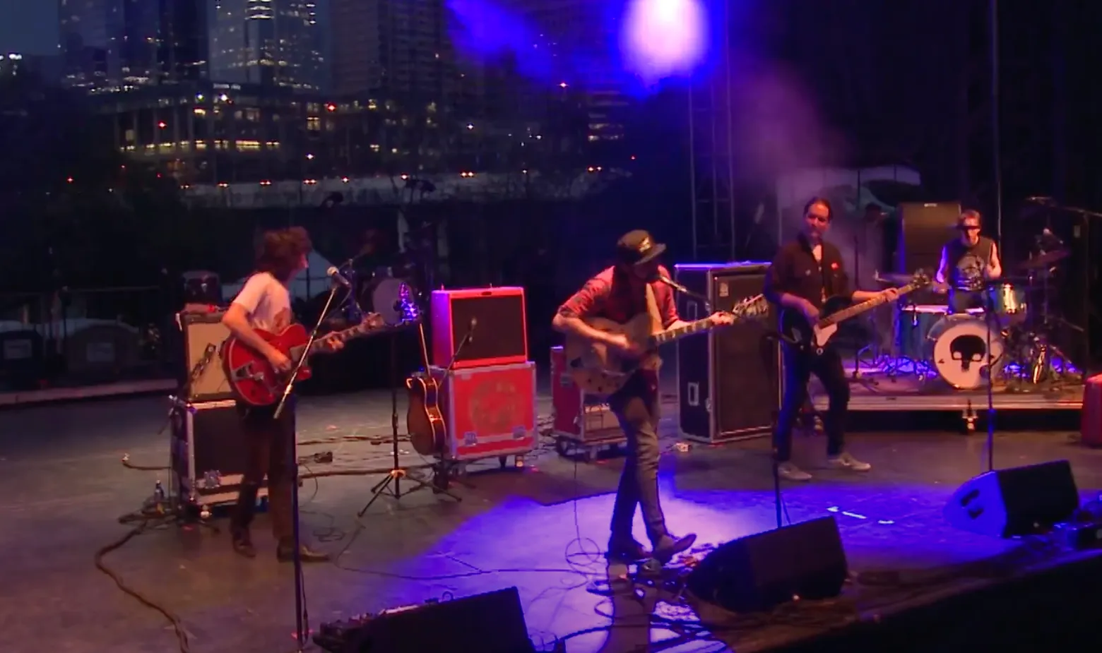 A band performs on an outdoor stage.